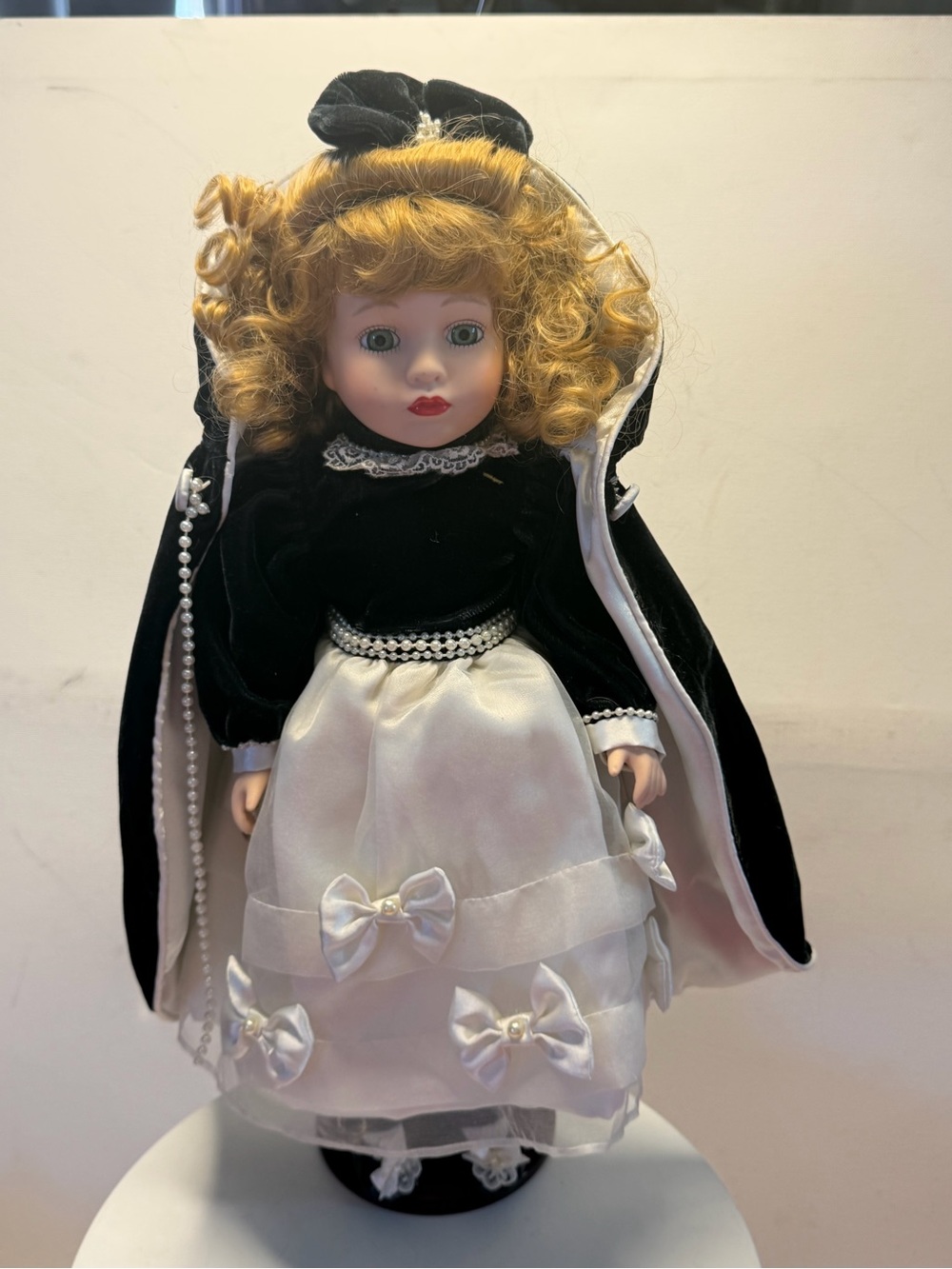 Classic Porcelain Doll in Black and White Dress - Elegant Collectible